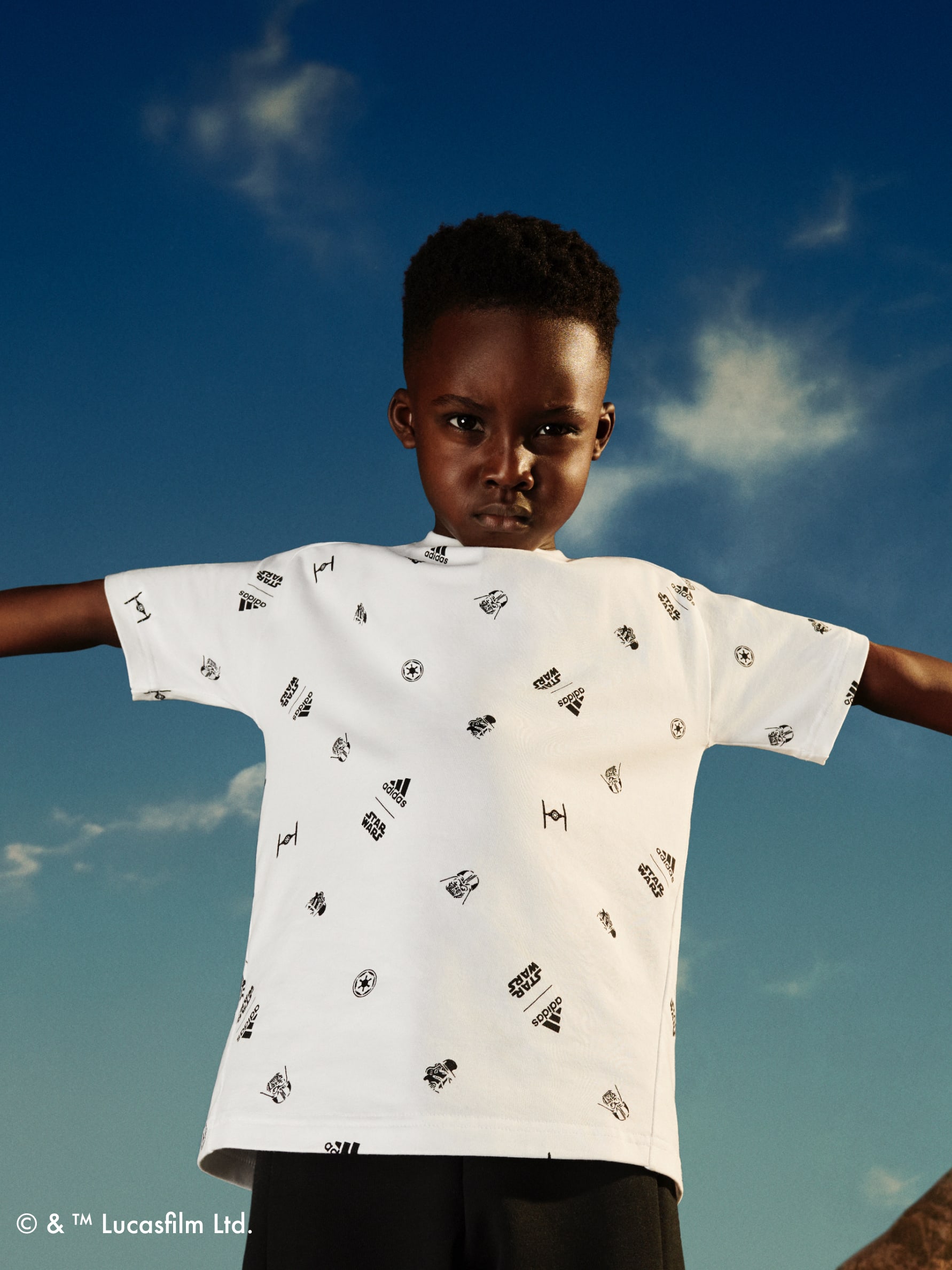 Boy with arms outstretched wearing adidas | Star Wars collection