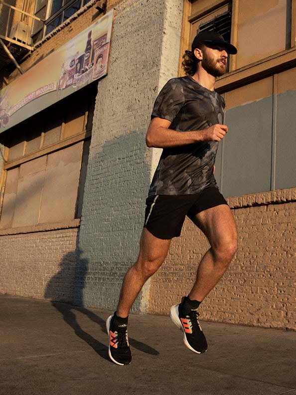 Image of a man running in the Ultraboost 22 shoe