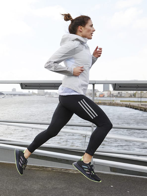 Close-up of woman running with her 4DFWD running shoes