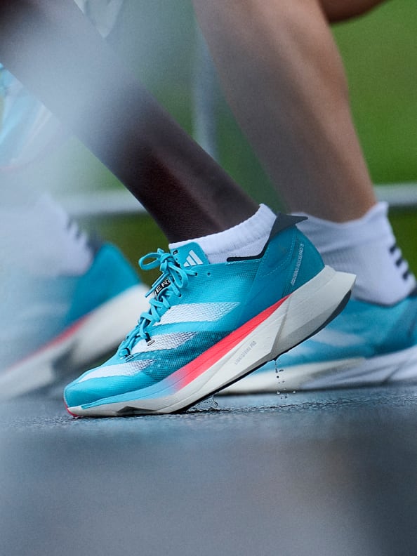 Montage featuring close-ups of Adizero Pro 3 worn by runners in motion, and GIF of Tigist Assefa crossing finish line at Berlin Marathon 2022