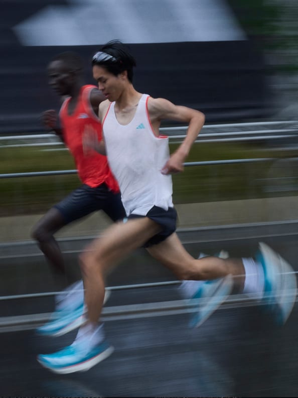 Montage featuring close-ups of Adizero Pro 3 worn by runners in motion, and GIF of Tigist Assefa crossing finish line at Berlin Marathon 2022