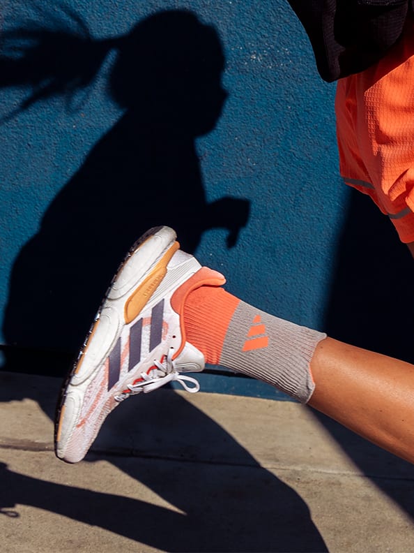 Image of a close up shot of a female running shoe