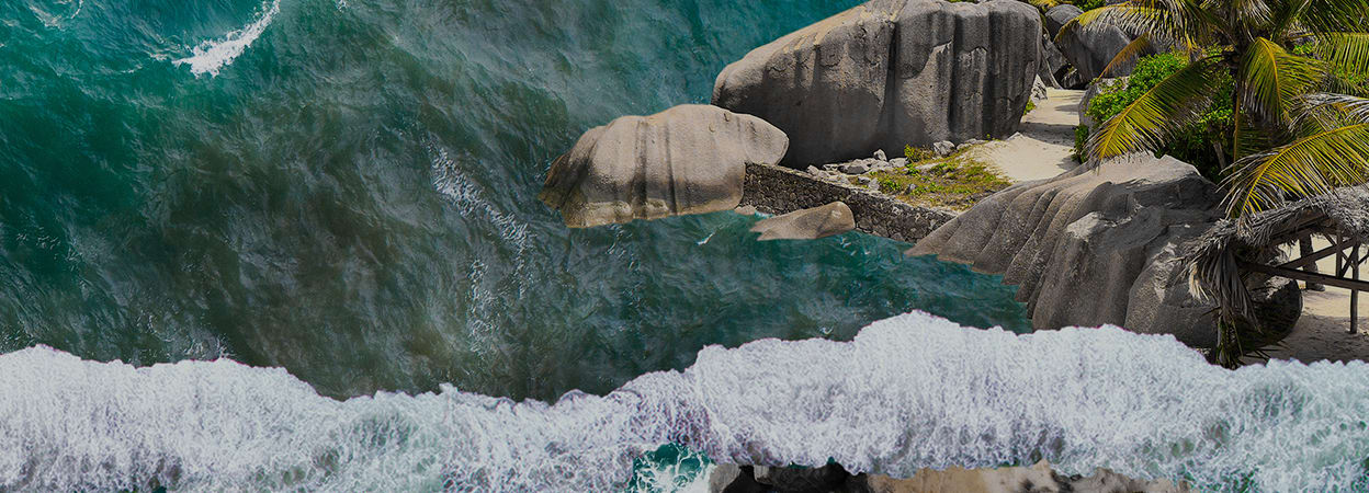 An ocean scene with a small rocky beach area