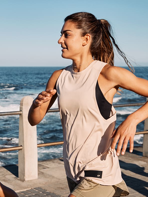 A woman is warming up to get ready for Run For The Oceans