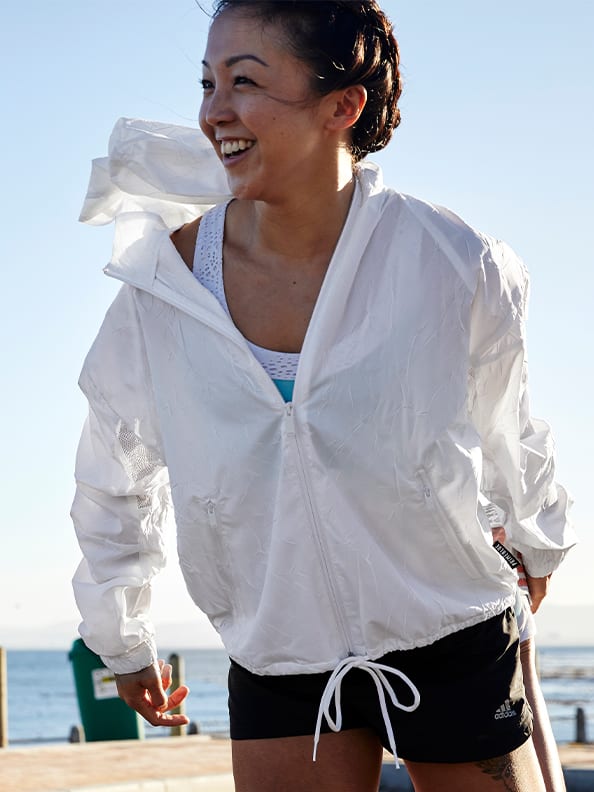 A woman is warming up to get ready for Run For The Oceans