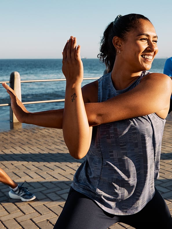 A woman is warming up to get ready for Run For The Oceans
