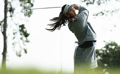 woman in golf clothing