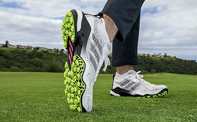 Laced golf shoe