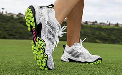 Laced golf shoe