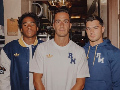 Three men wearing FC Real Madrid lifestyle gear