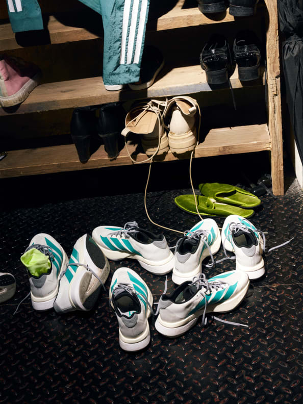 Four images show of various male and female runners wearing the new Adizero Boston 13 in urban settings.