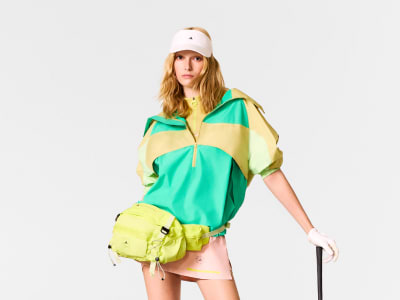 Close up of model standing posing with golf club