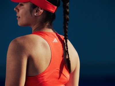 Focus of a woman player in an adidas tank top.