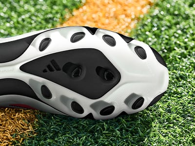 An outsole of an adidas football boot made to be played on multiple surfaces