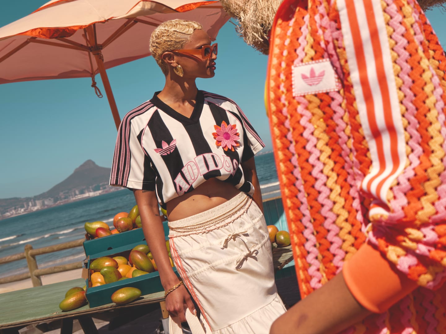 Photograph of two male models wearing adidas 2025 Summer Glow collection.