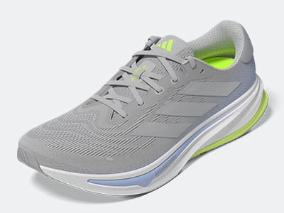 The image shows the close-up view of a sneaker, with a textured mesh upper and a blue sole.
