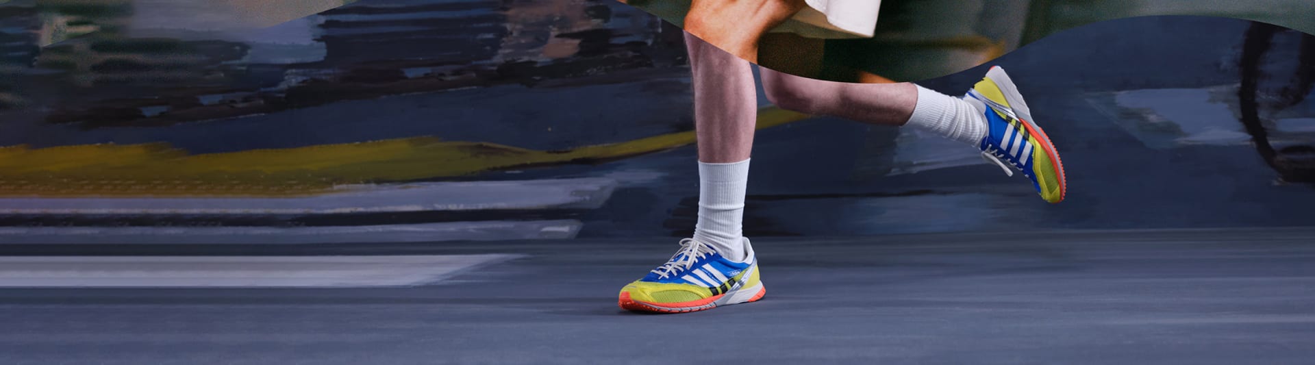 Runner’s legs wearing blue, yellow and red running shoes and white socks.