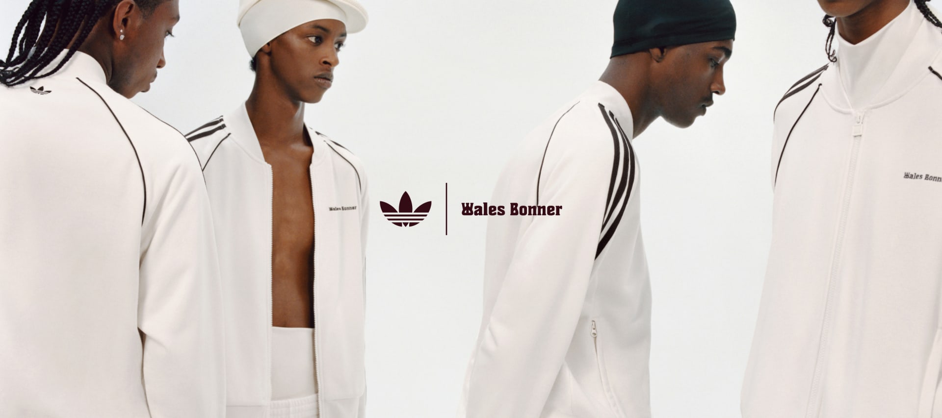 Four models are posing against a white background, all wearing white outfits from the adidas Originals by Wales Bonner collection.