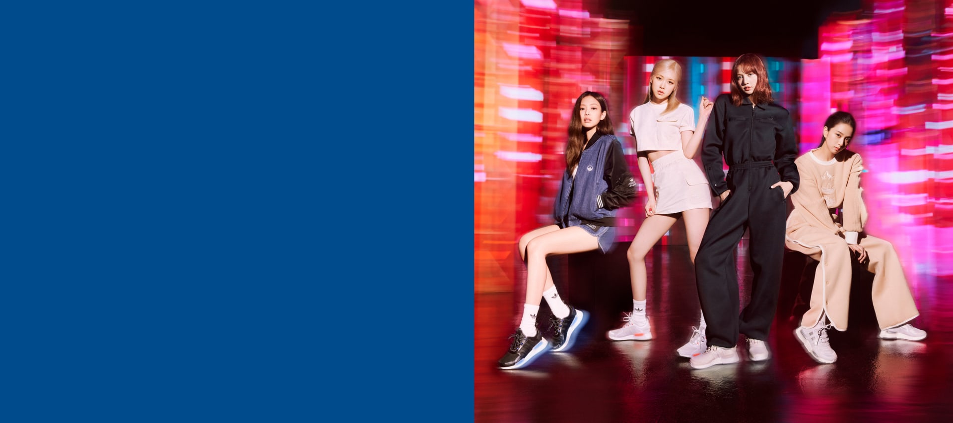 Two kids playfully pose in the latest evolution of the NMD.