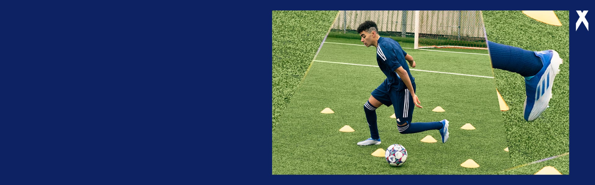 Image of male talent with blue kit dribbling the ball on the pitch. Yellow cones.