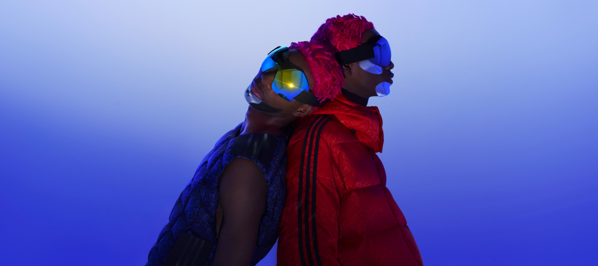 A model is shown wearing the Moncler x adidas Originals collection.