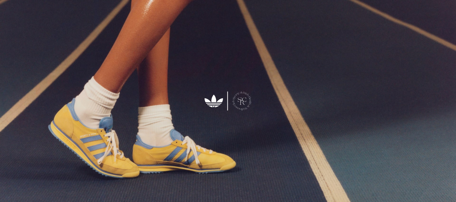 The adidas Originals x Sporty & Rich SL 72 shoes are photographed on model legs against a retro fitness background.
