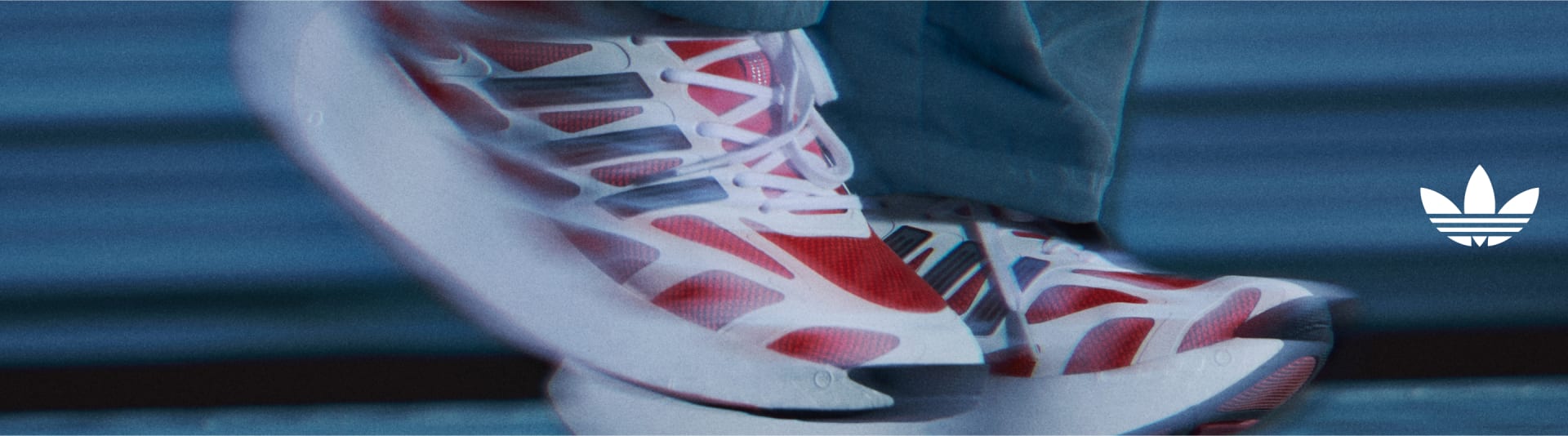 Close up image of the adizero ARUKU shoes in motion.