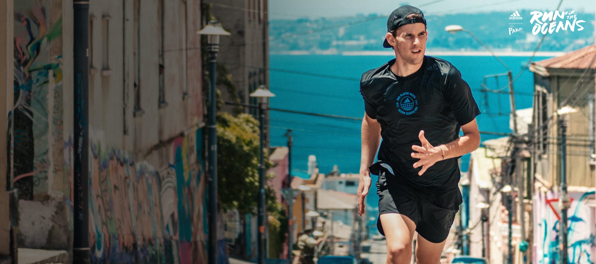 Visual of Dominic Thiem running in a street.