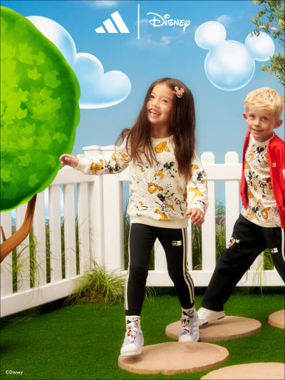 Two children playing wearing the adidas | Disney collection