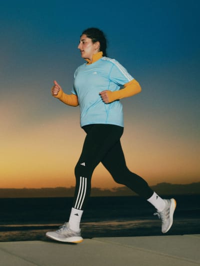 Female running in running outfit.
