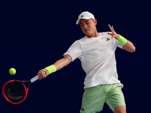 Wu Yibing playing tennis in the new Melbourne collection.