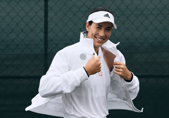 Female tennis player wearing the UNIFORIA jacket