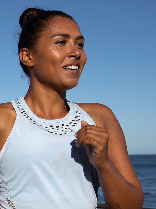A woman is warming up to get ready for Run For The Oceans