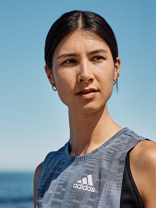 A woman is warming up to get ready for Run For The Oceans