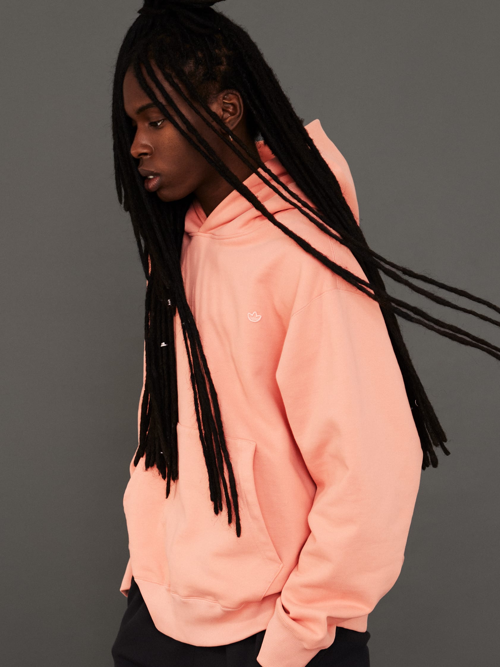 Stylish men and a woman pose in classic, bold and contemporary adicolor outfits.