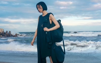 Woman in Y-3 apparel and accessories standing on the Japanese coastline