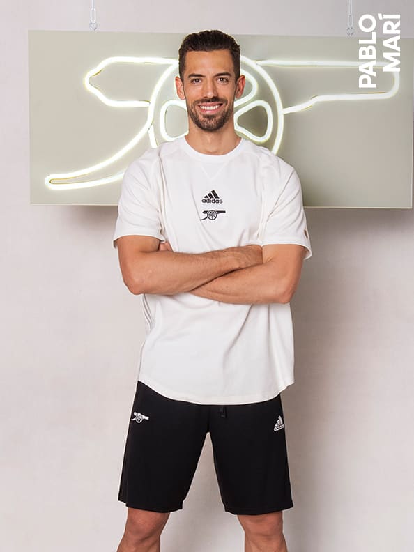 Male and female players wearing the Arsenal Travel Collection