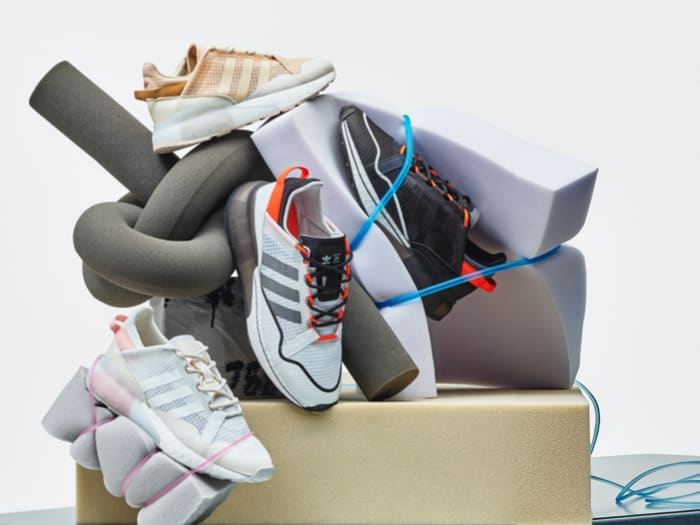 All four ZX 2K BOOST PURE unisex and women's shoes are stacked up.