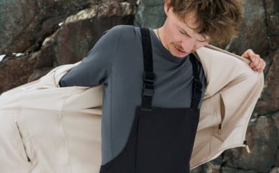 Male wears layers from the Terrex Adventure Wardrobe FW24 Collection