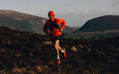 Male trail runners wears pieces from the Terrex Adventure Wardrobe FW24 Collection
