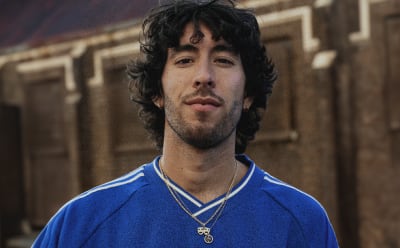 A man is photographed wearing adidas Originals.