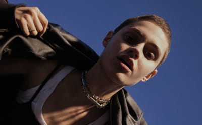 A woman is photographed wearing adidas Originals.