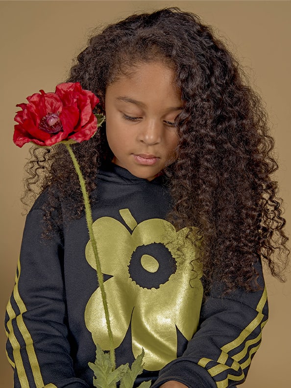 Child wearing adidas x Marimekko clothing