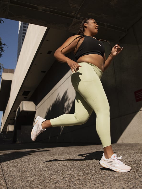 Image of a woman running in the Solarglide 5 shoe