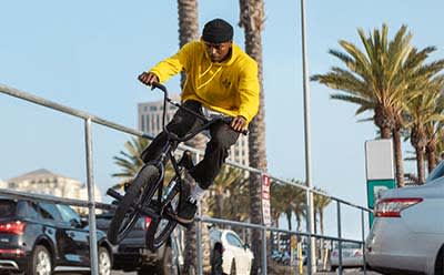 Professional BMX rider DeMarcus Paul and a member of his community reaching their summit