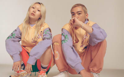 A male and female model pose wearing the gender neutral True pace collection. Click on this image to filter the collection by lifestyle.