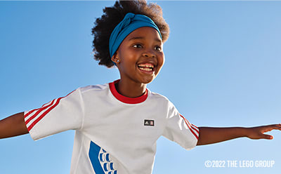 Young girl in headband playing and smiling