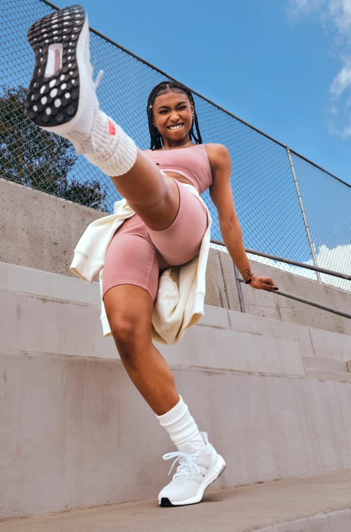 Young woman showing sportswear outfit.
