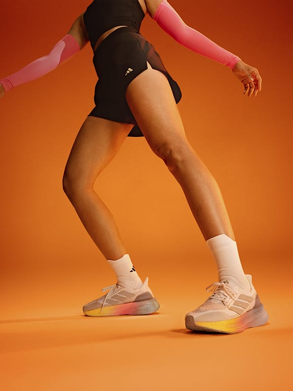 In-studio image of legs wearing Ultraboost 5X.