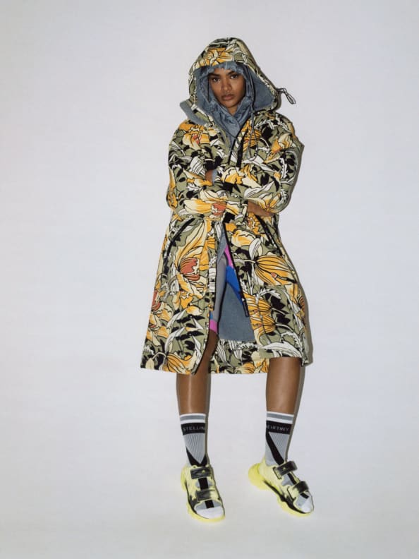 Thara stands wearing the Truenature Robe Outdoor Jacket from the new SS23 adidas by Stella McCartney.